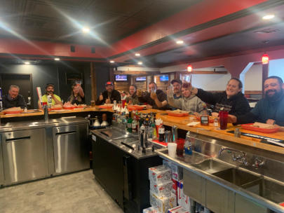 People siting at the bar at Trailhead Bar and Grill taken from the owner side of the bar